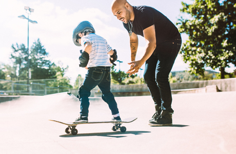 dad and son skateboarding